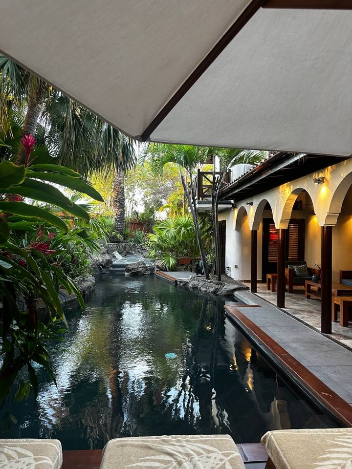 A private pool surrounded by tropical plants at a Baoase villa