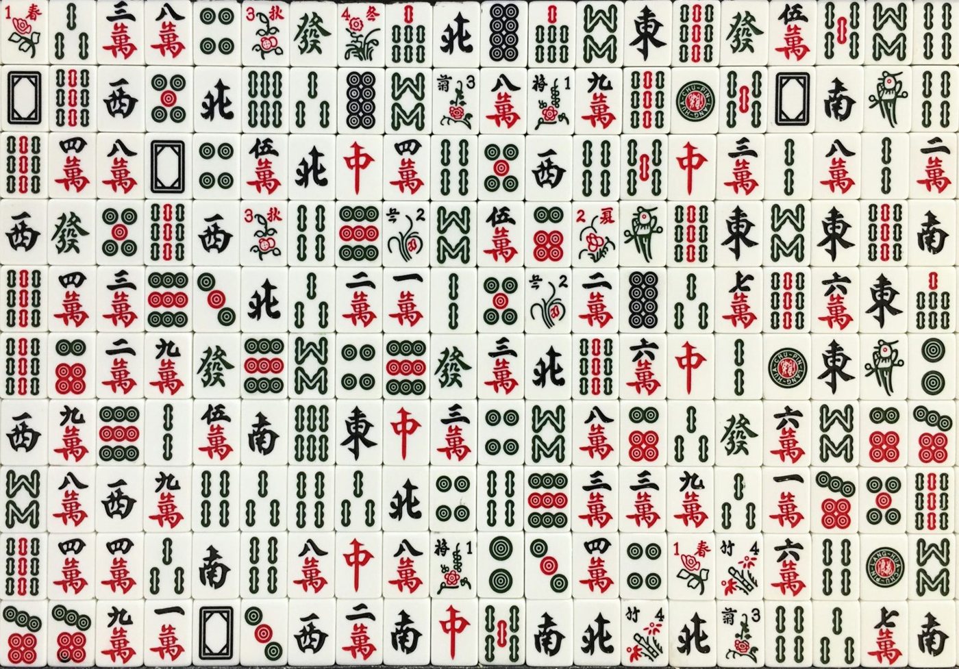 Rows of traditional mahjong tiles laid out face up