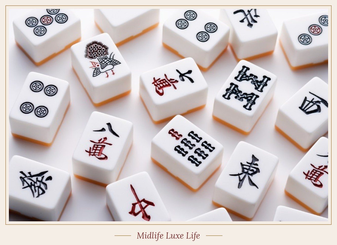 Bright white mahjong tiles with orange backs scattered on a white table