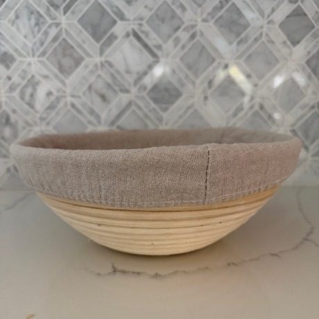 Linen-lined banneton proofing basket on the counter